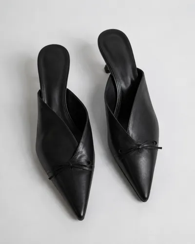 Pointed black leather mules with a low heel
